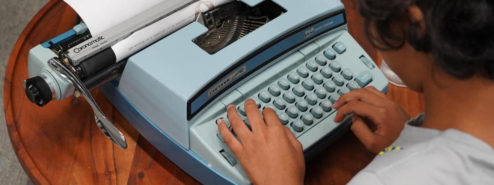 YWI student typing